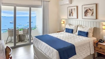 Habitación de lujo, vistas al mar | Minibar, caja fuerte, ropa de cama
