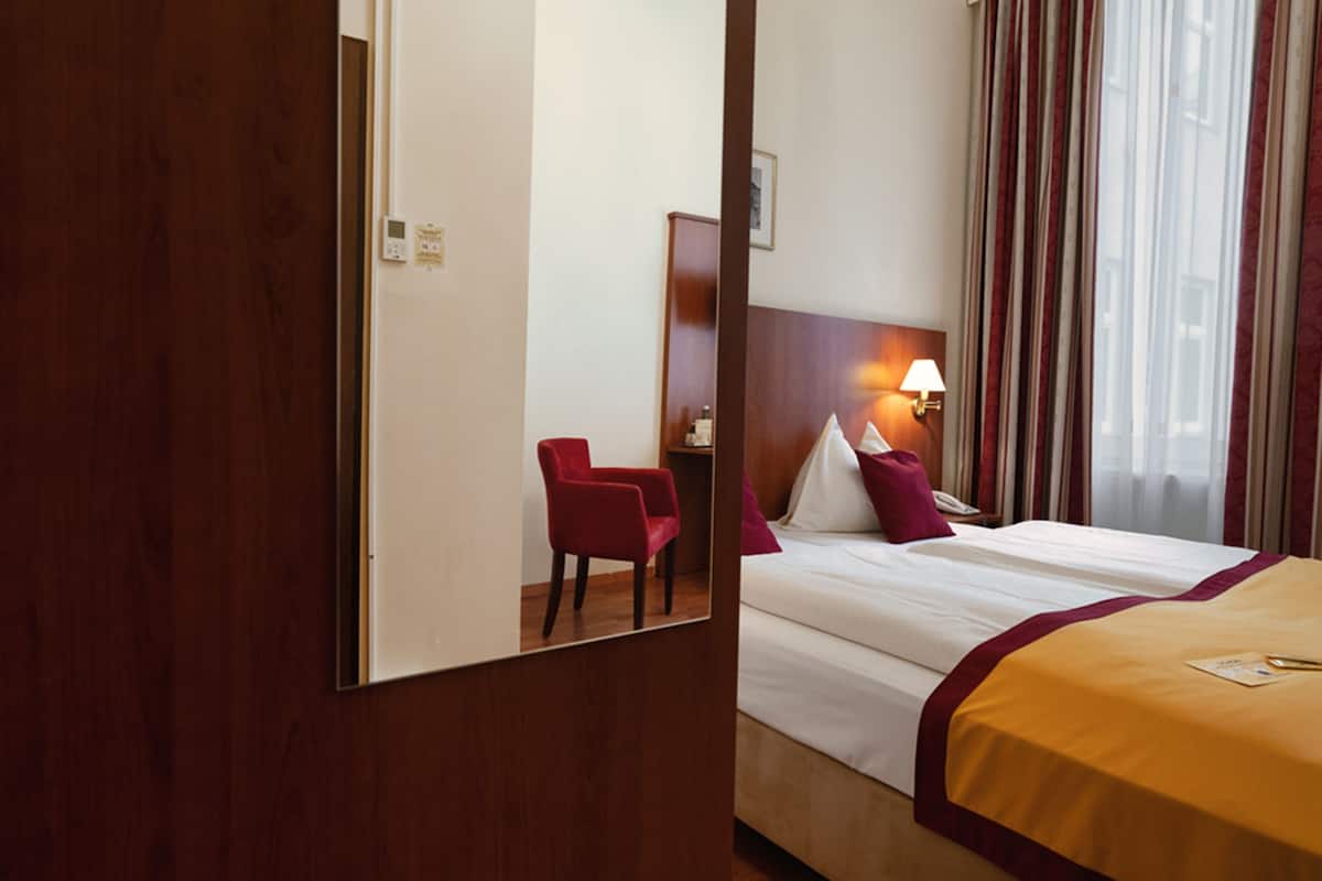 Economy Double Room | Individually furnished, desk, blackout drapes, rollaway beds