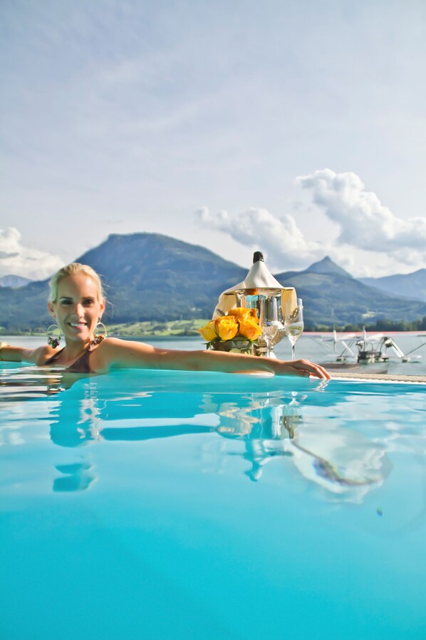 Indoor pool, outdoor pool, pool umbrellas, pool loungers