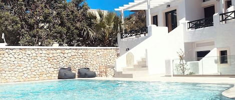 Seasonal outdoor pool, open 10:00 AM to 7:00 PM, sun loungers