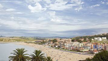 Enjoy the vibrant atmosphere of this bustling coastal city with its wide beach and diverse architecture.