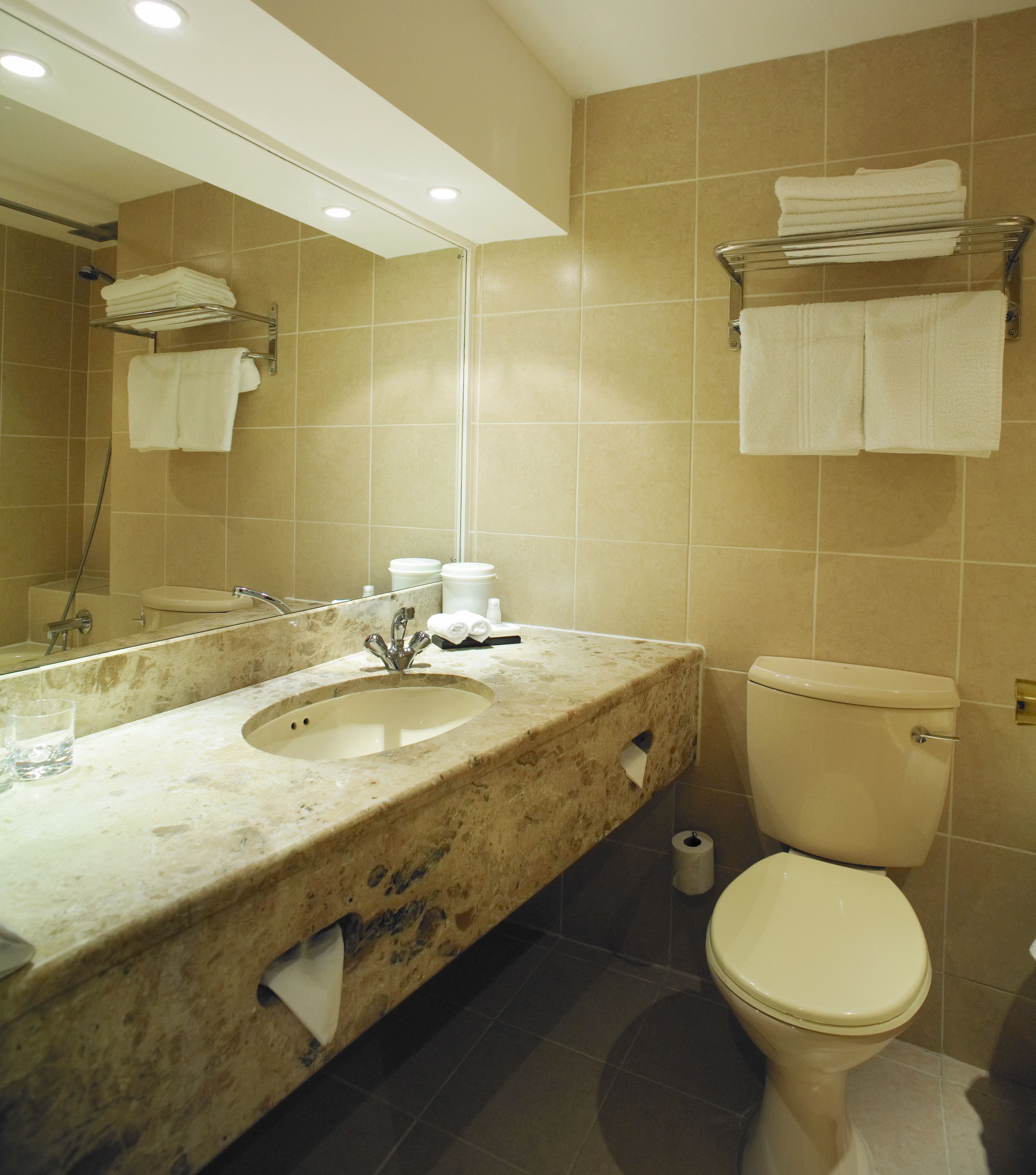 designer toiletries, hair dryer, towels