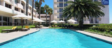 Outdoor pool, pool umbrellas, sun loungers