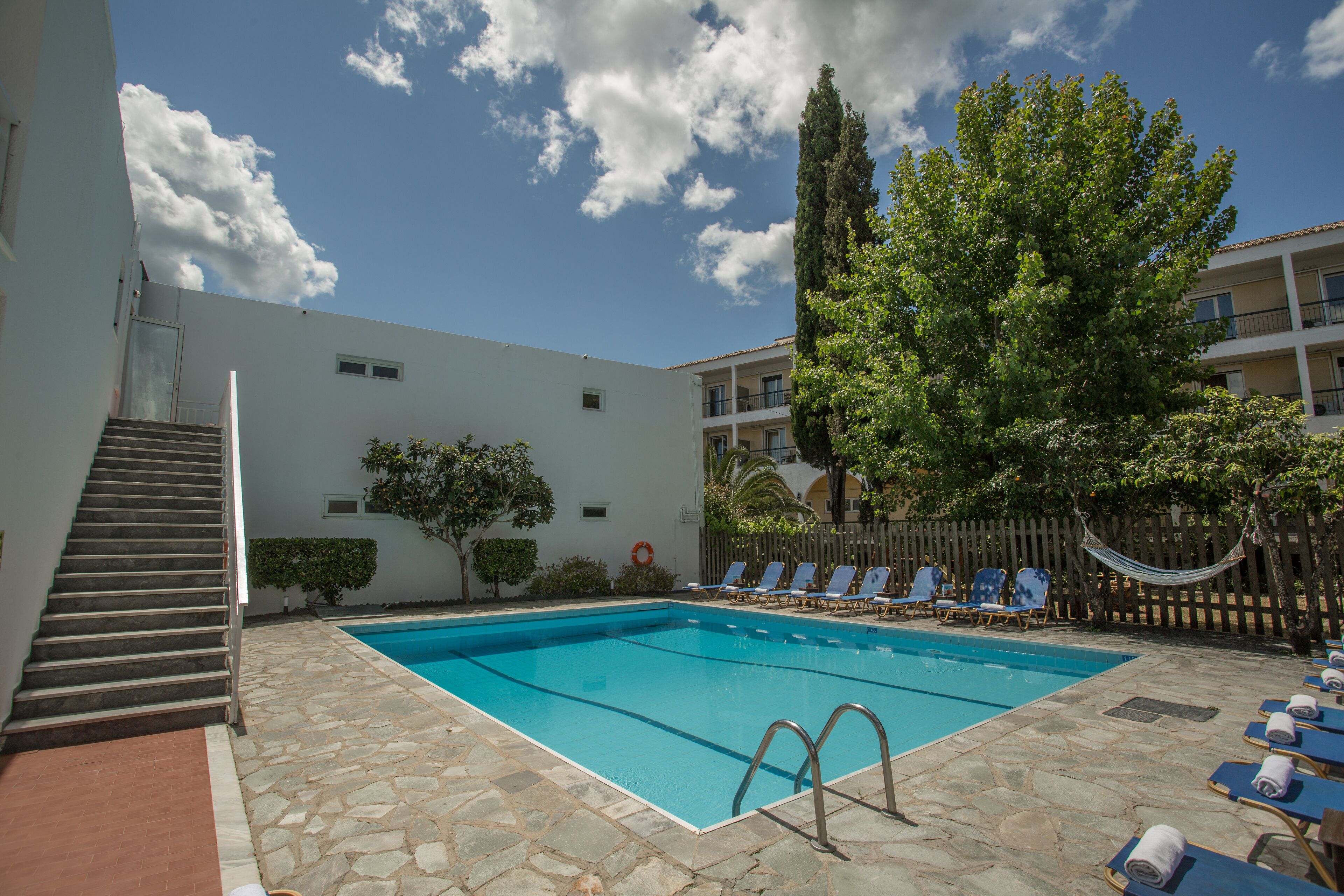Seasonal outdoor pool, open 8 AM to 7:30 PM, pool umbrellas