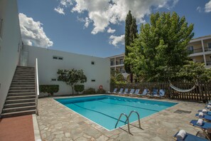 Seasonal outdoor pool, open 8 AM to 7:30 PM, pool umbrellas