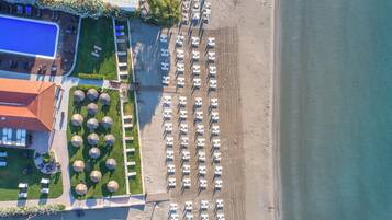On the beach, sun loungers, beach umbrellas, beach towels