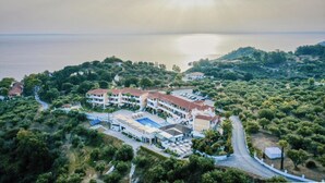 A coastal hotel with multiple buildings, a swimming pool, and a view of the sea. - Matilda Hotel by Anayia All Inclusive Resorts (Zakynthos)