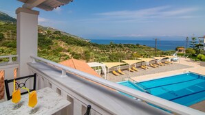 A pool area with a view of the sea, lounge chairs, and a clear sky. - Matilda Hotel by Anayia All Inclusive Resorts (Zakynthos)