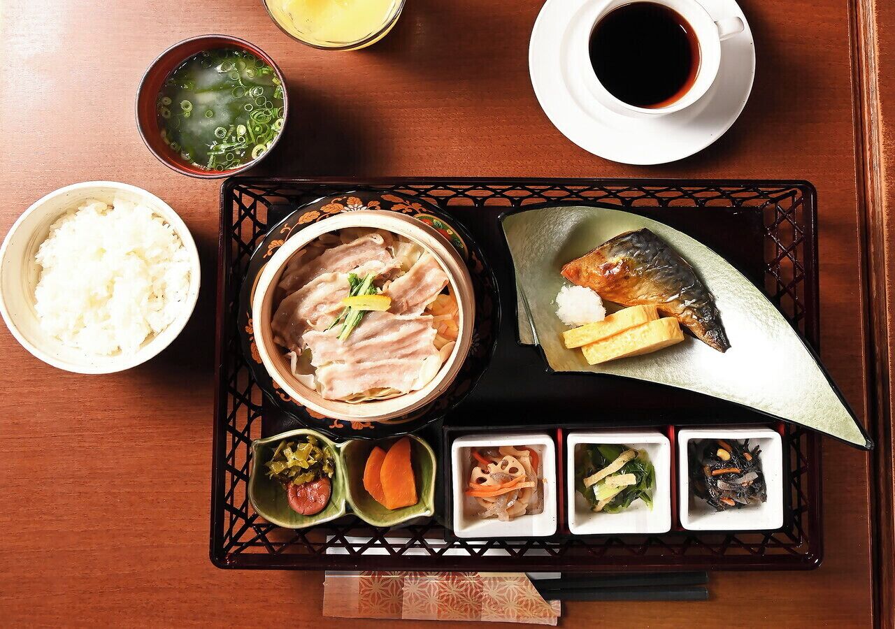 A traditional Japanese meal with various dishes on a tray.