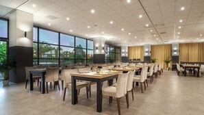 A spacious conference room with multiple tables and chairs, large windows offering a view of greenery outside, and a modern ceiling design. - Hotel Sopron (Sopron)