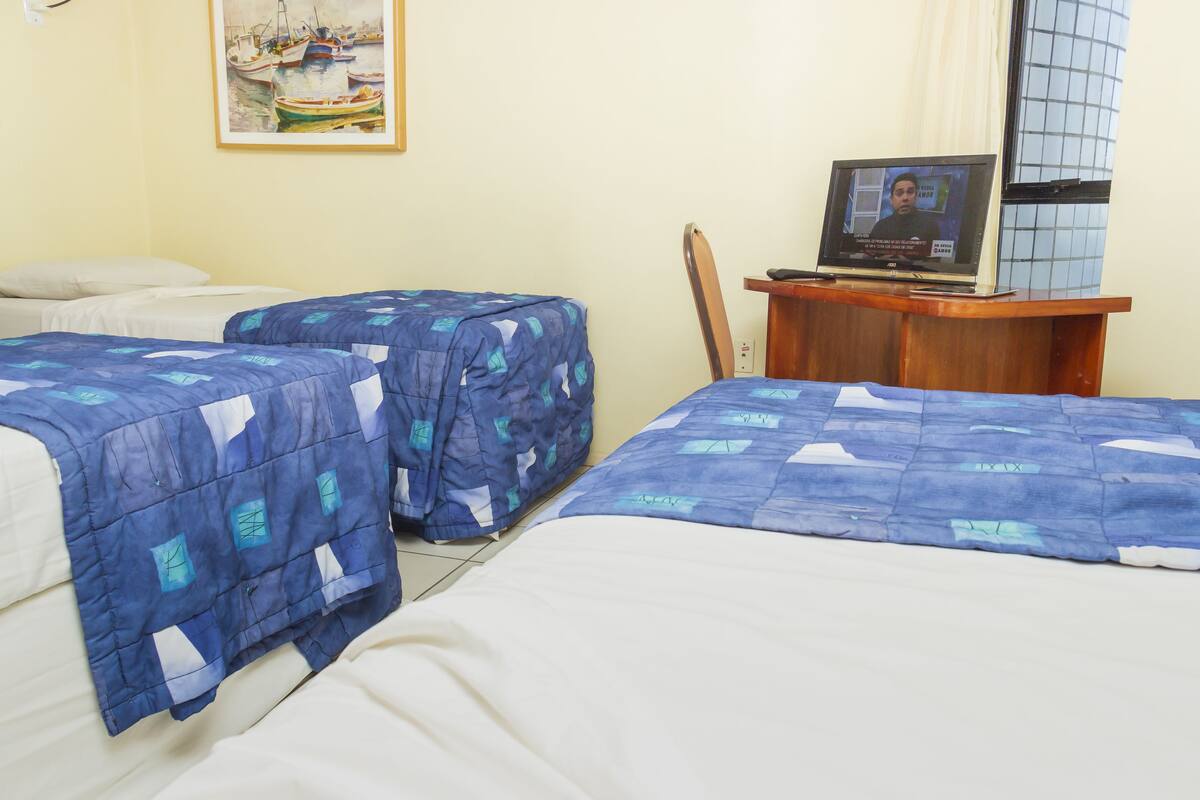 Standard Triple Room | Minibar, in-room safe, desk, blackout drapes