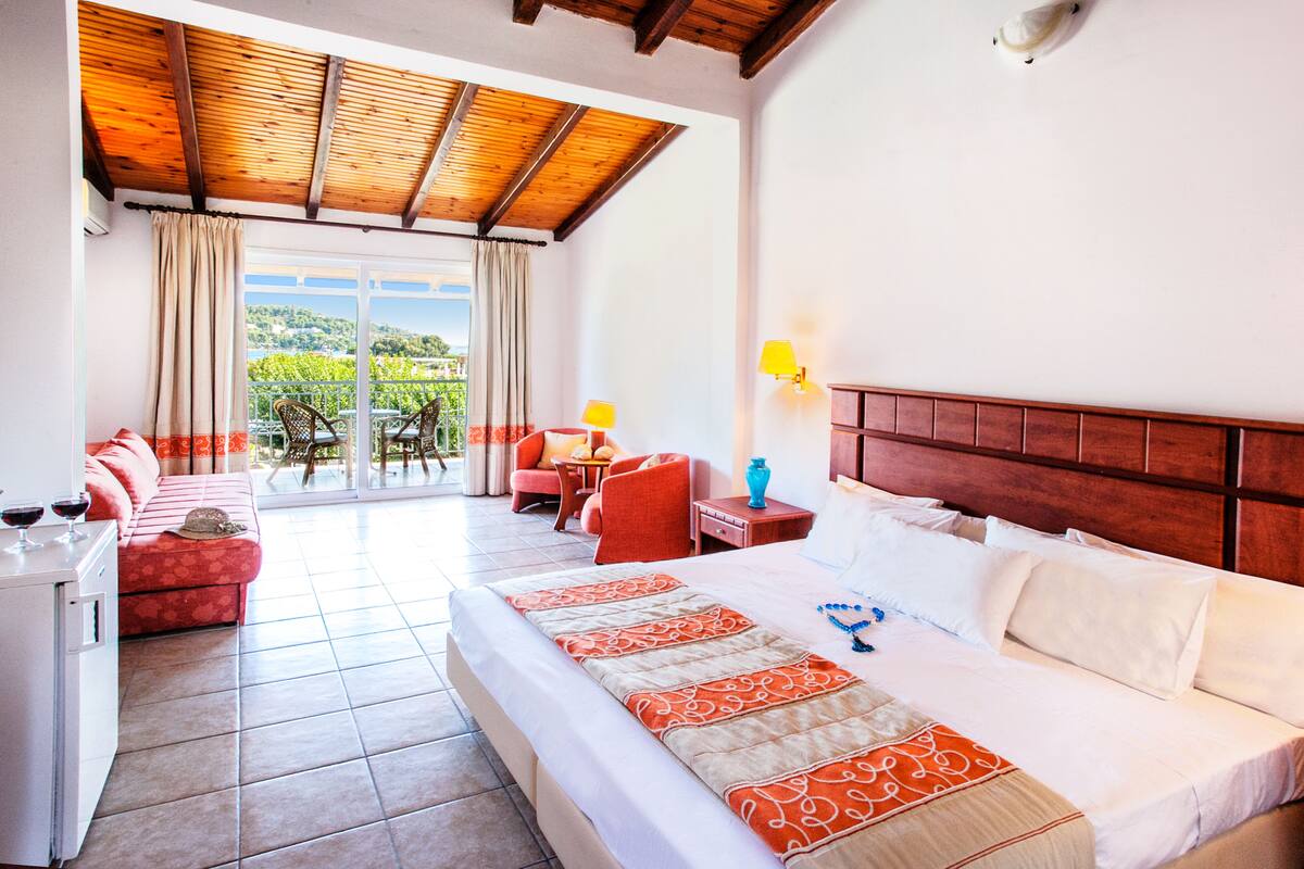 Family Room, Pool View (Superior) | Minibar, in-room safe, blackout drapes, iron/ironing board (on request)