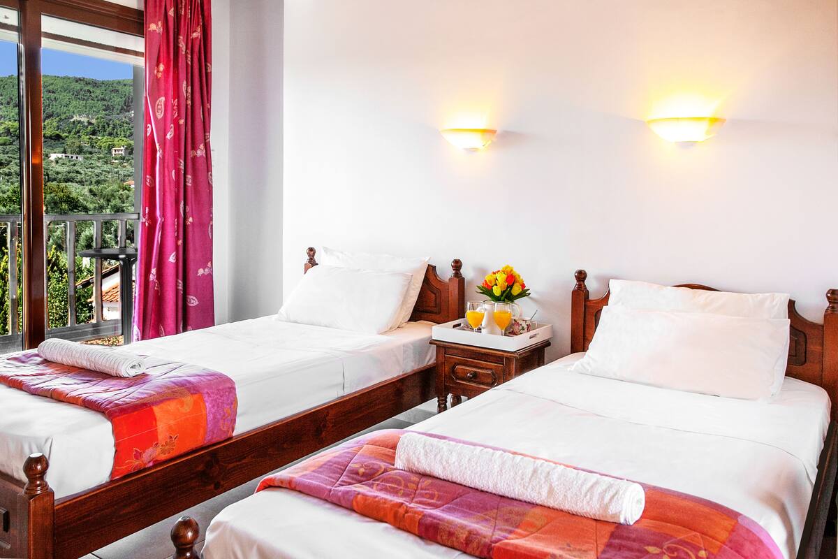 Classic Triple Room, Garden View | Minibar, in-room safe, blackout drapes, iron/ironing board (on request)