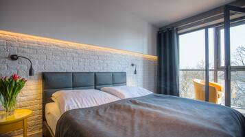 Deluxe Double Room, River View | In-room safe, desk, iron/ironing board, cribs/infant beds