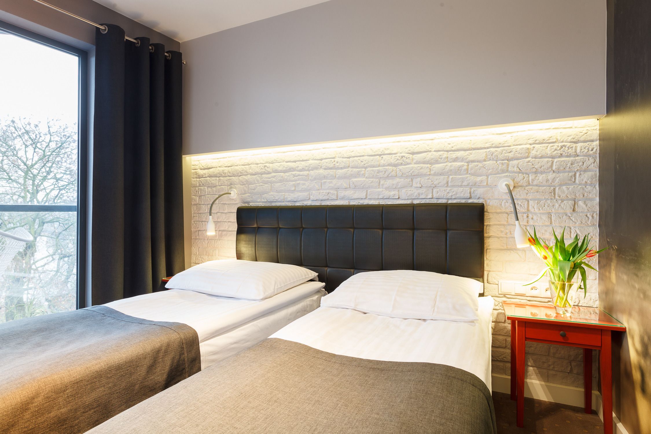 deluxe double room, river view | in-room safe, desk, iron/ironing board, cots/infant beds