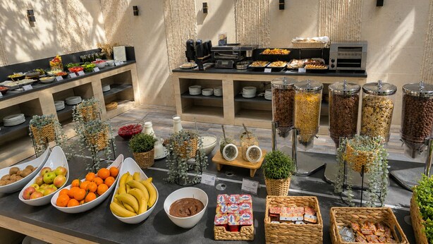 A buffet with various food items, including fruits, vegetables, and condiments. - Vitosha Park Hotel (Sofia)