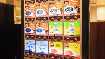 A vending machine with various drink options including iced tea and coffee blends.
