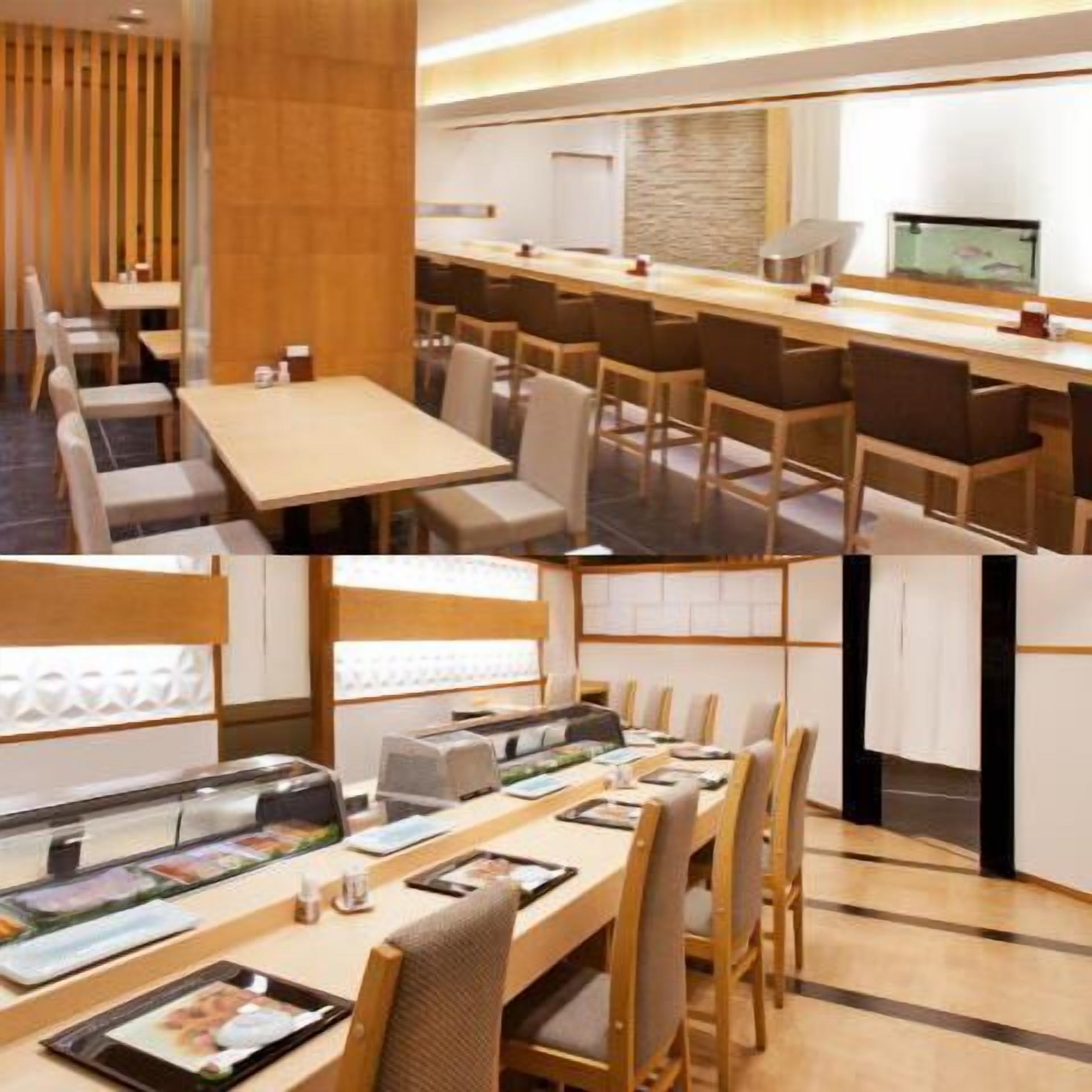 A modern restaurant with wooden furniture, a long counter, and a variety of seating options.