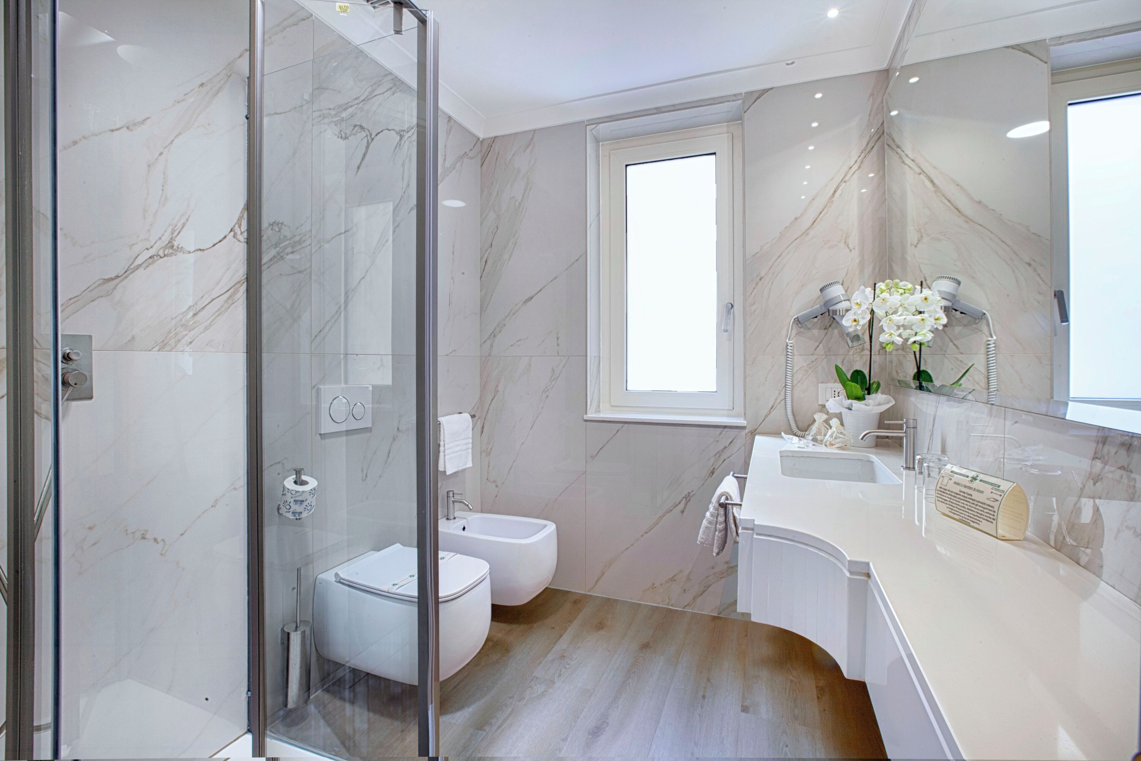 deluxe room | bathroom | free toiletries, hair dryer, slippers, bidet