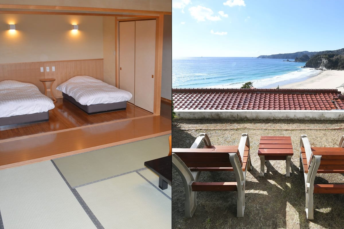 A hotel room with two beds, a wooden floor, and a view of the beach.