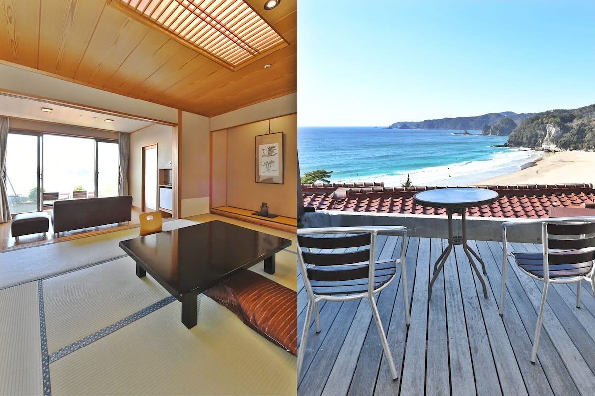 A room with tatami flooring, a low table, and a view of the ocean.