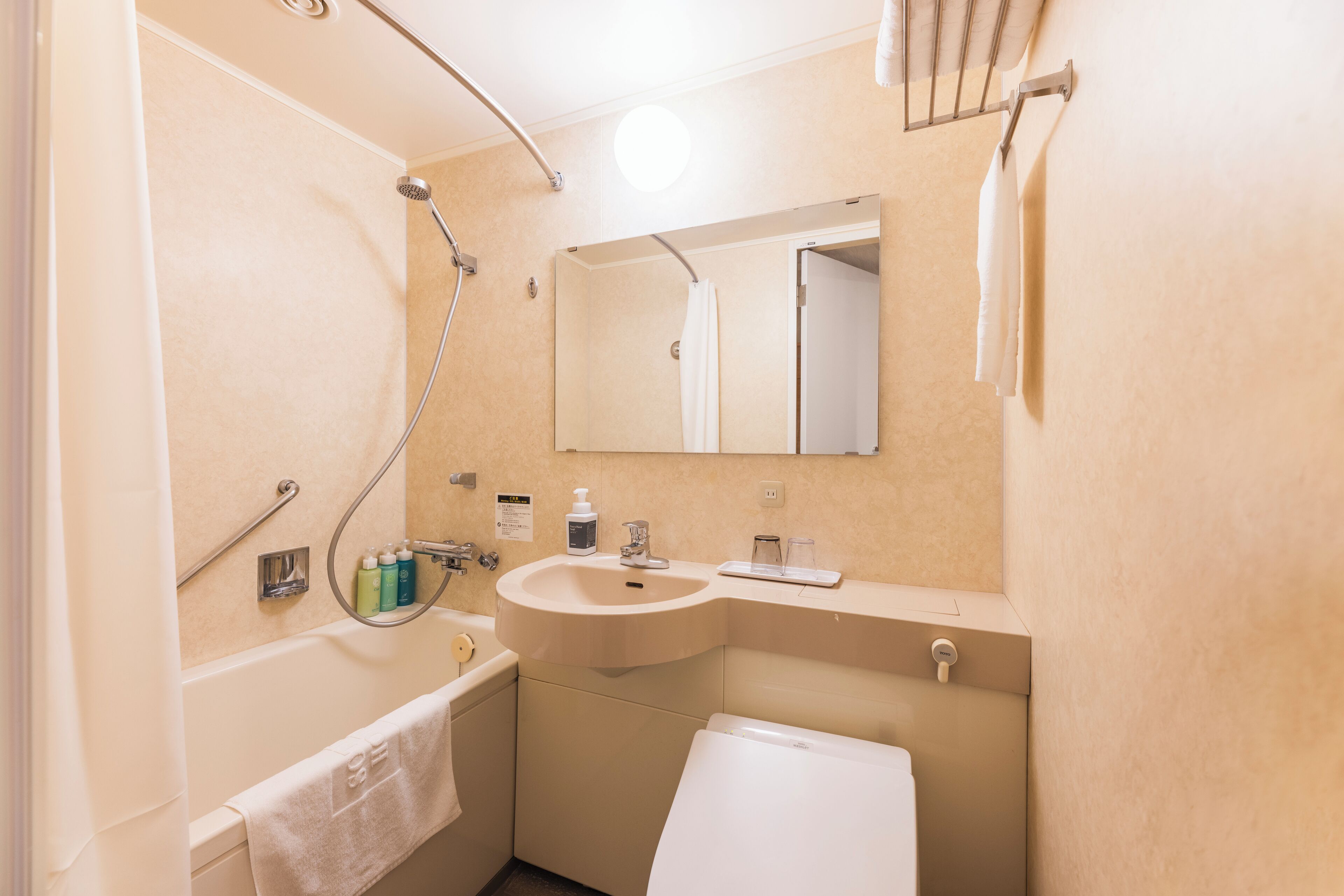 combined shower/bathtub, free toiletries, hair dryer, slippers