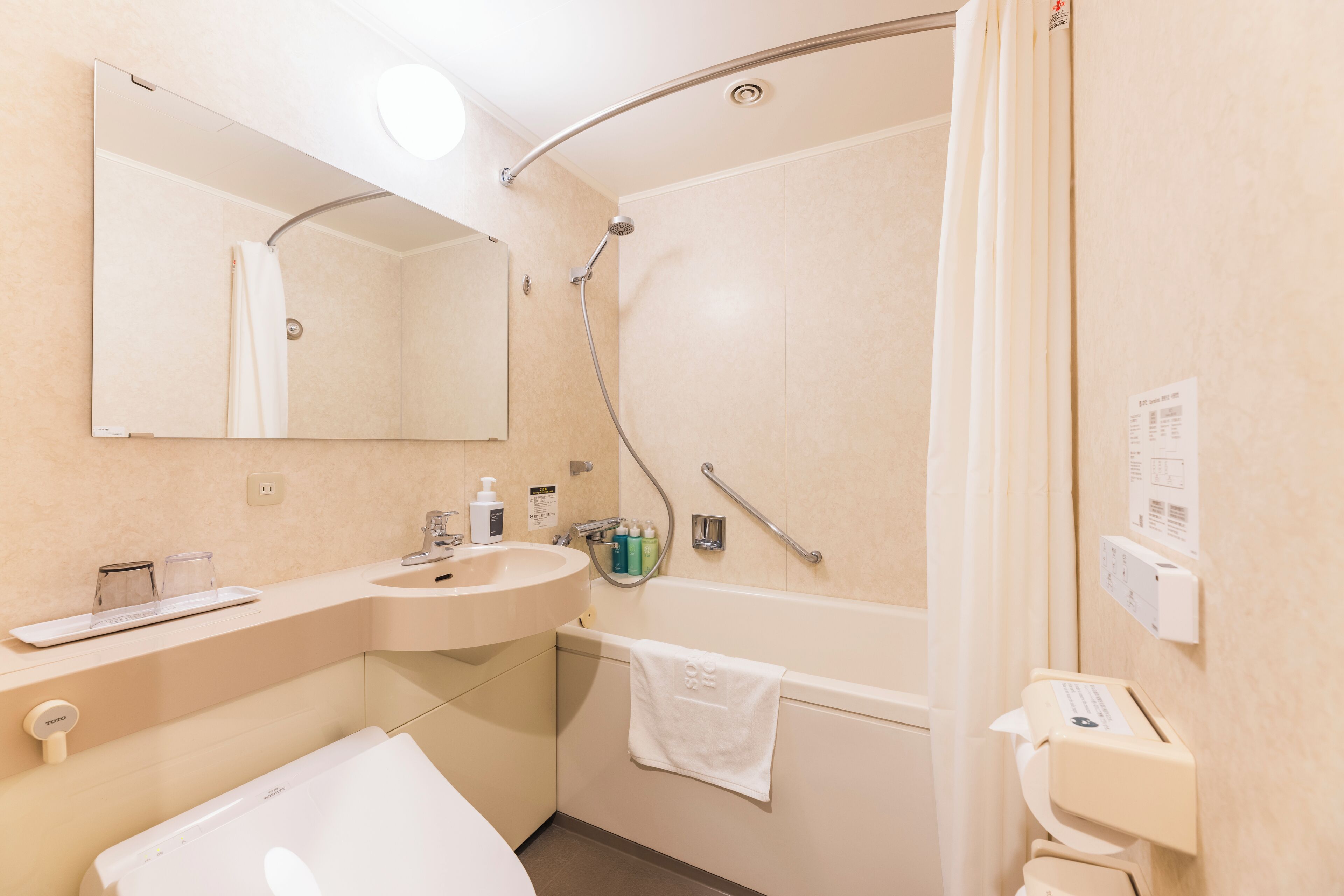 combined shower/bathtub, free toiletries, hair dryer, slippers