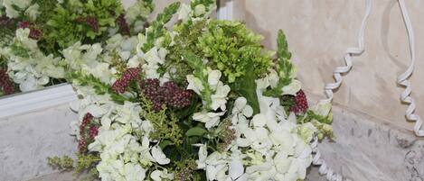 A bouquet of flowers on a marble surface.