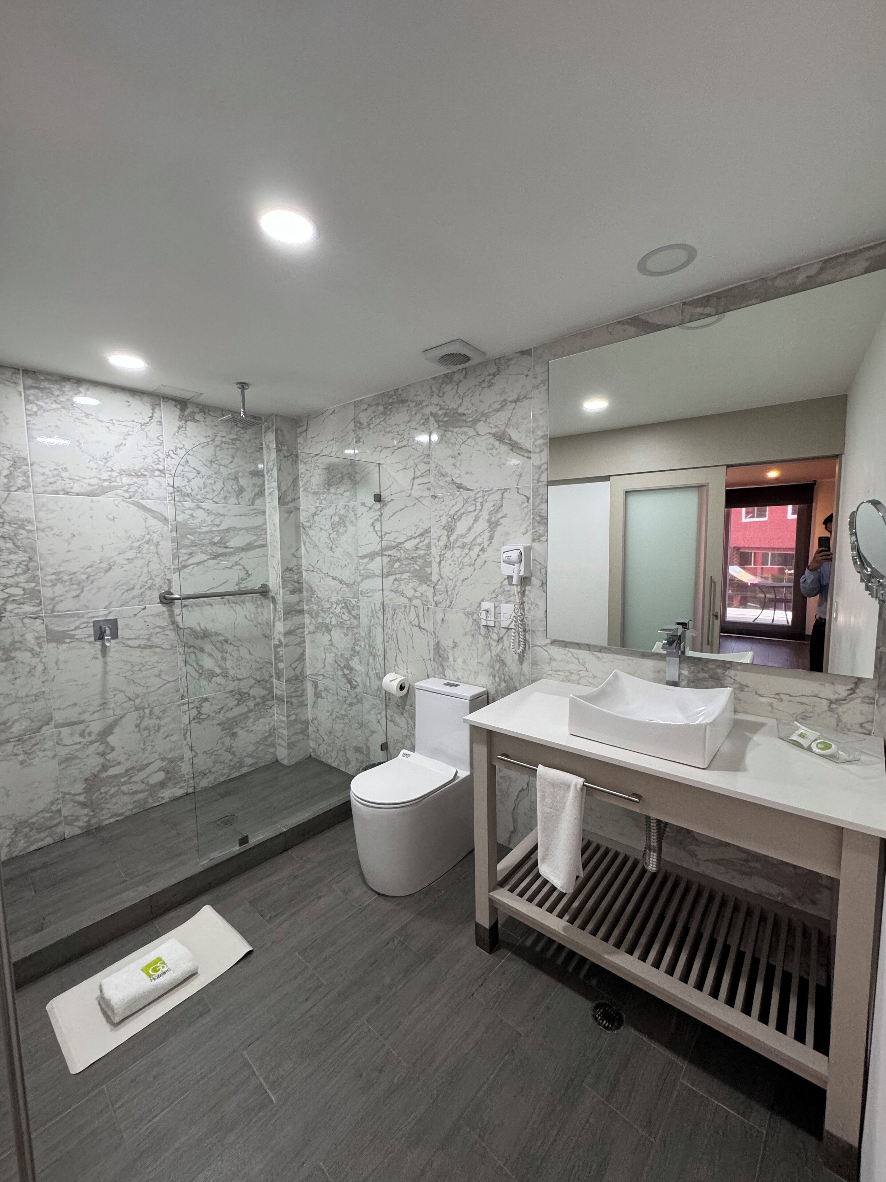 shower, designer toiletries, hair dryer, slippers