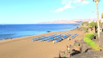 Beach nearby, white sand, sun loungers, beach umbrellas