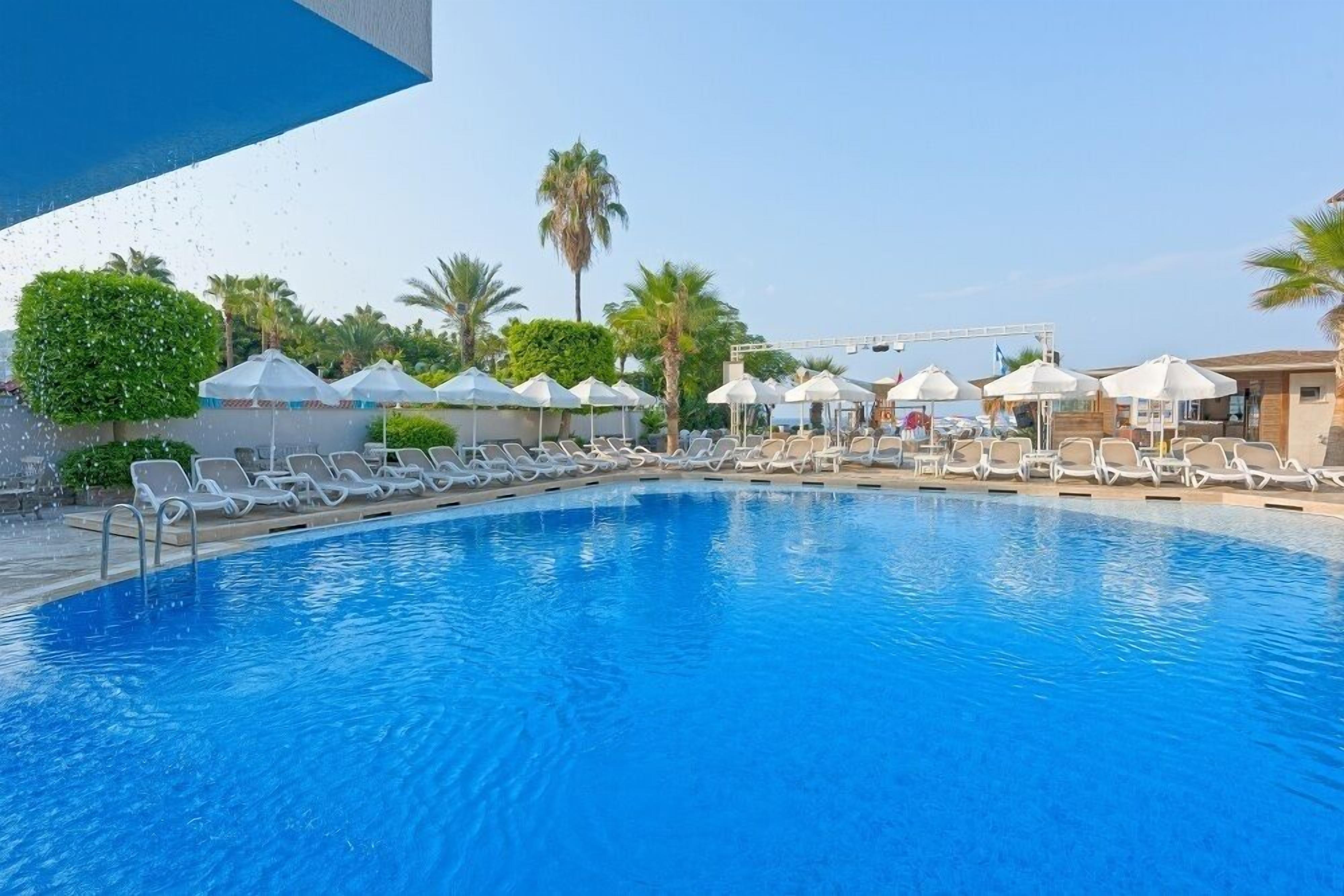 Outdoor pool, open 9:00 AM to 7:00 PM, pool umbrellas, sun loungers