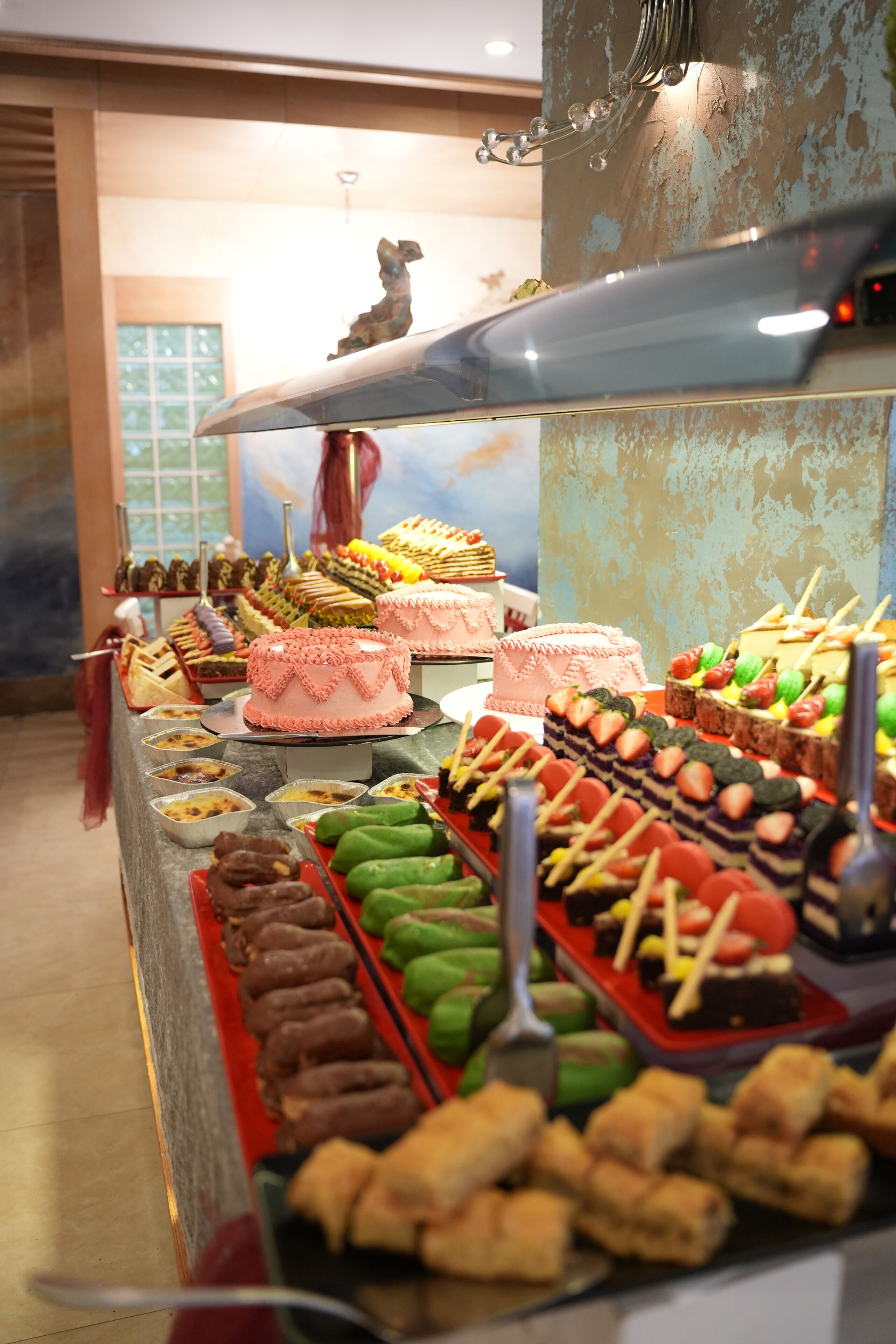 A buffet with various desserts and snacks.