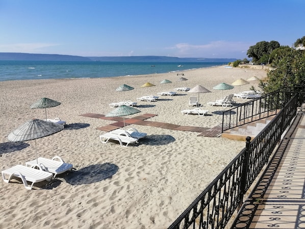Private beach, free beach cabanas, beach shuttle, sun loungers