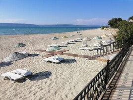 Private beach, free beach cabanas, beach shuttle, sun loungers