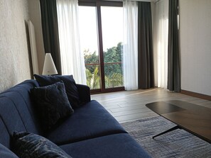 Suite – deluxe, 1 queensize-seng | Oppholdsområde