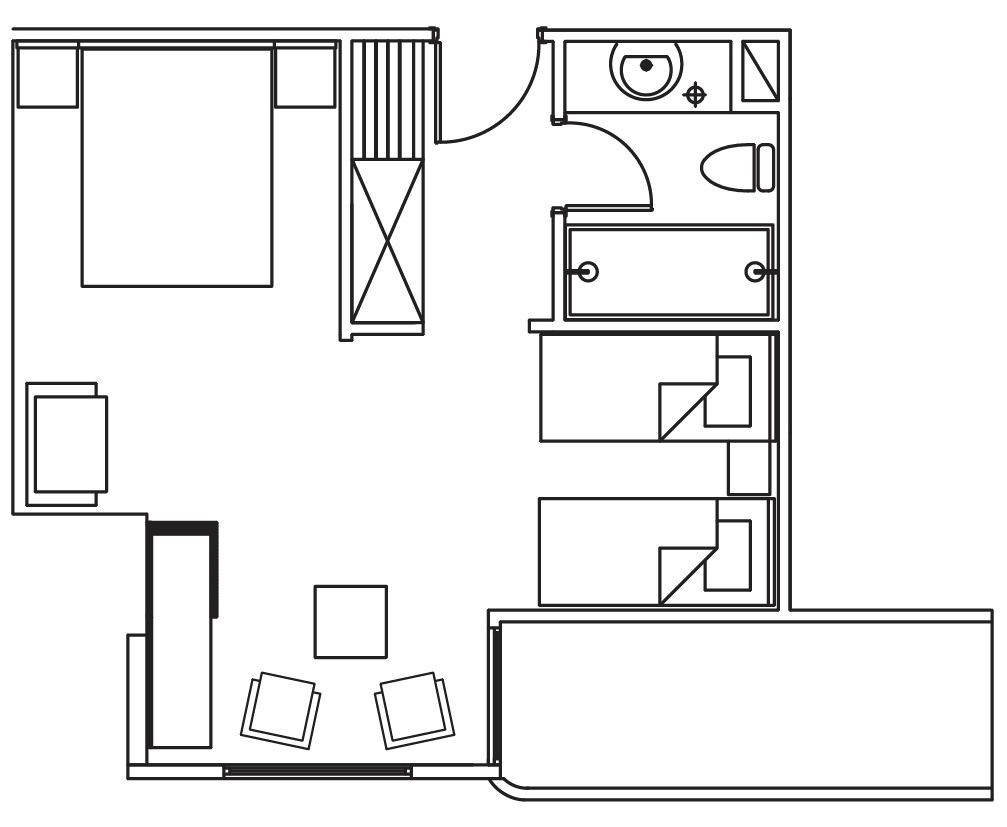 A floor plan with a large central room, a kitchen area, and a dining area with four chairs.