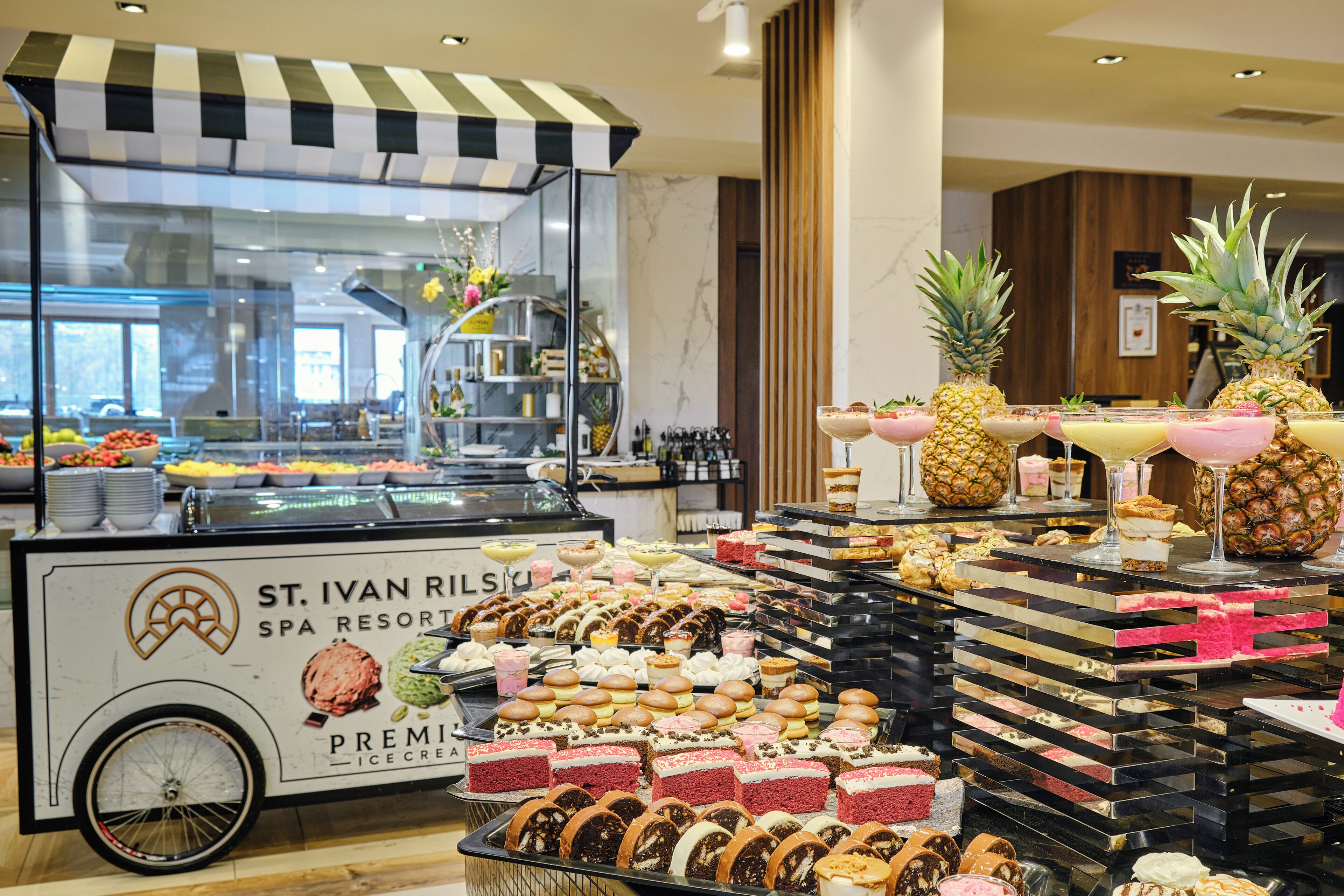 A dessert display at a hotel with various ice cream and pastries.