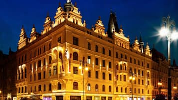 Experience the grandeur of this historic hotel, featuring ornate facades and multiple spires.
