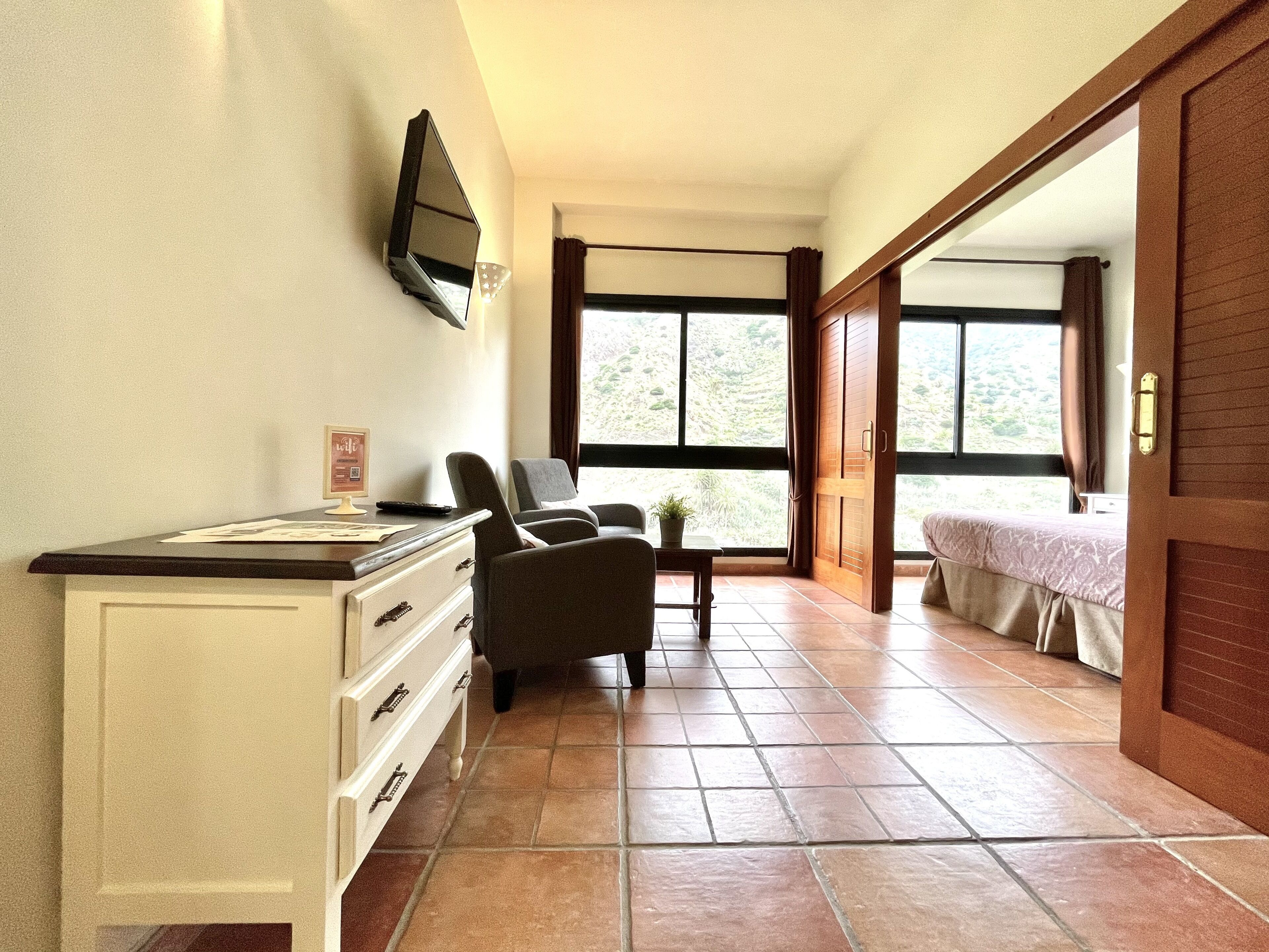 panoramic apartment, 1 bedroom, mountain view | living room | 32-inch led tv with digital channels, tv