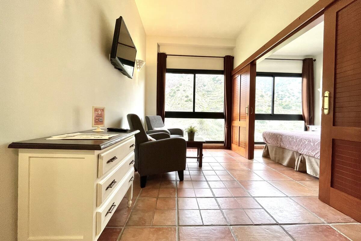 panoramic apartment, 1 bedroom, mountain view | living room | 32-inch led tv with digital channels, tv