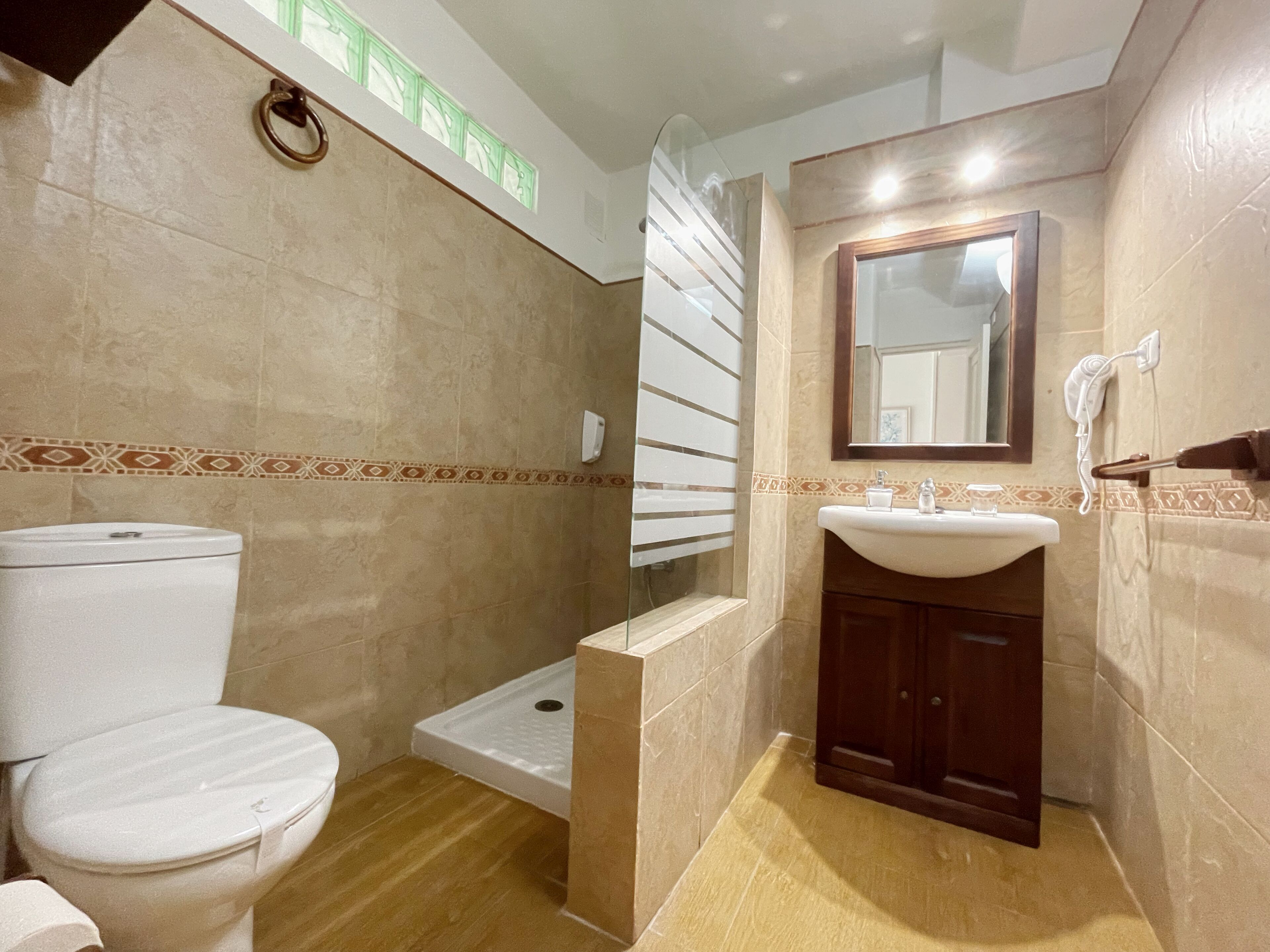 basic studio | bathroom | shower, hair dryer, towels, soap