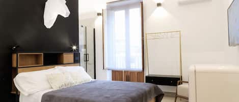 Deluxe Room | 1 bedroom, down comforters, minibar, individually decorated