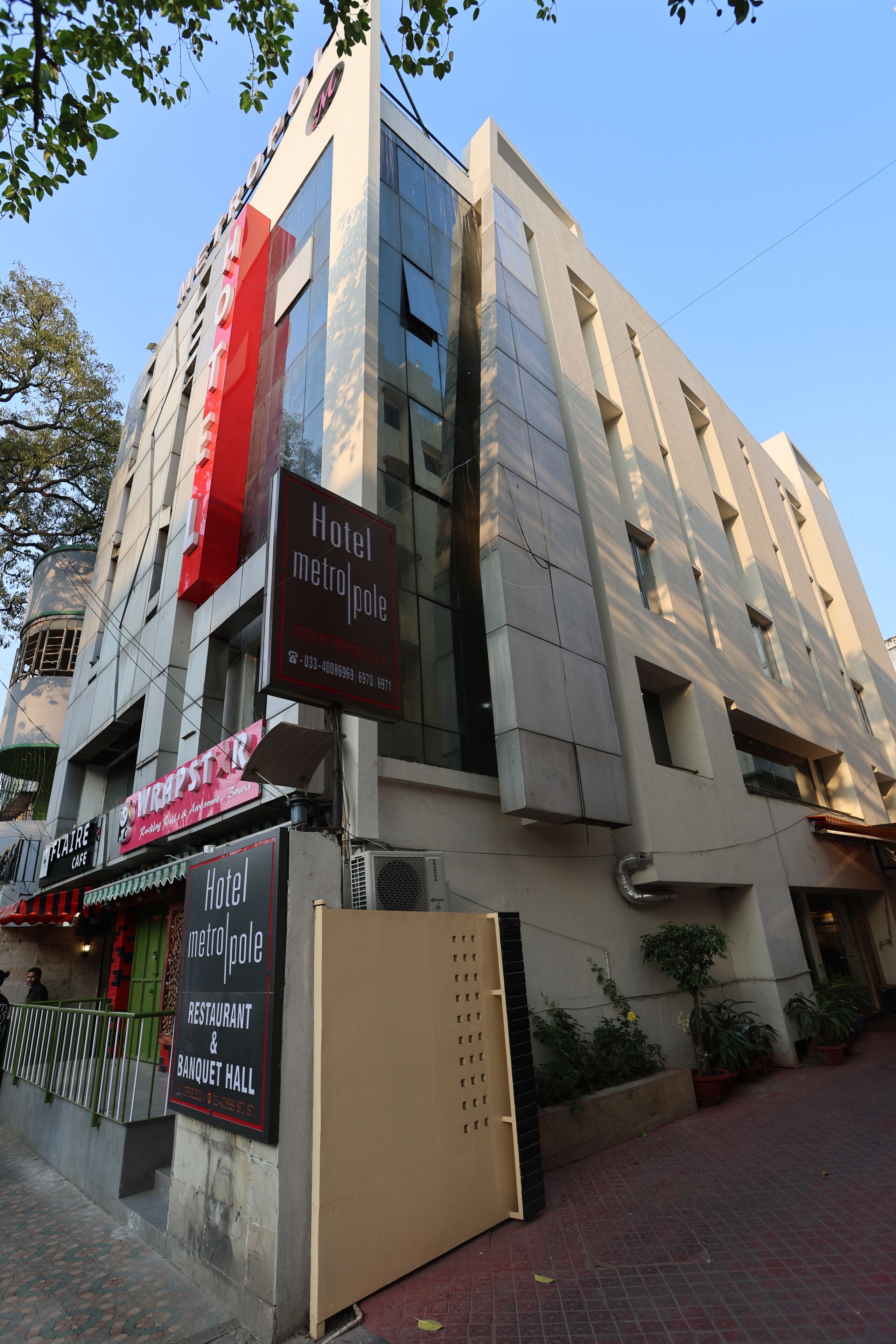 A hotel with a modern facade, including a restaurant and banquet hall.