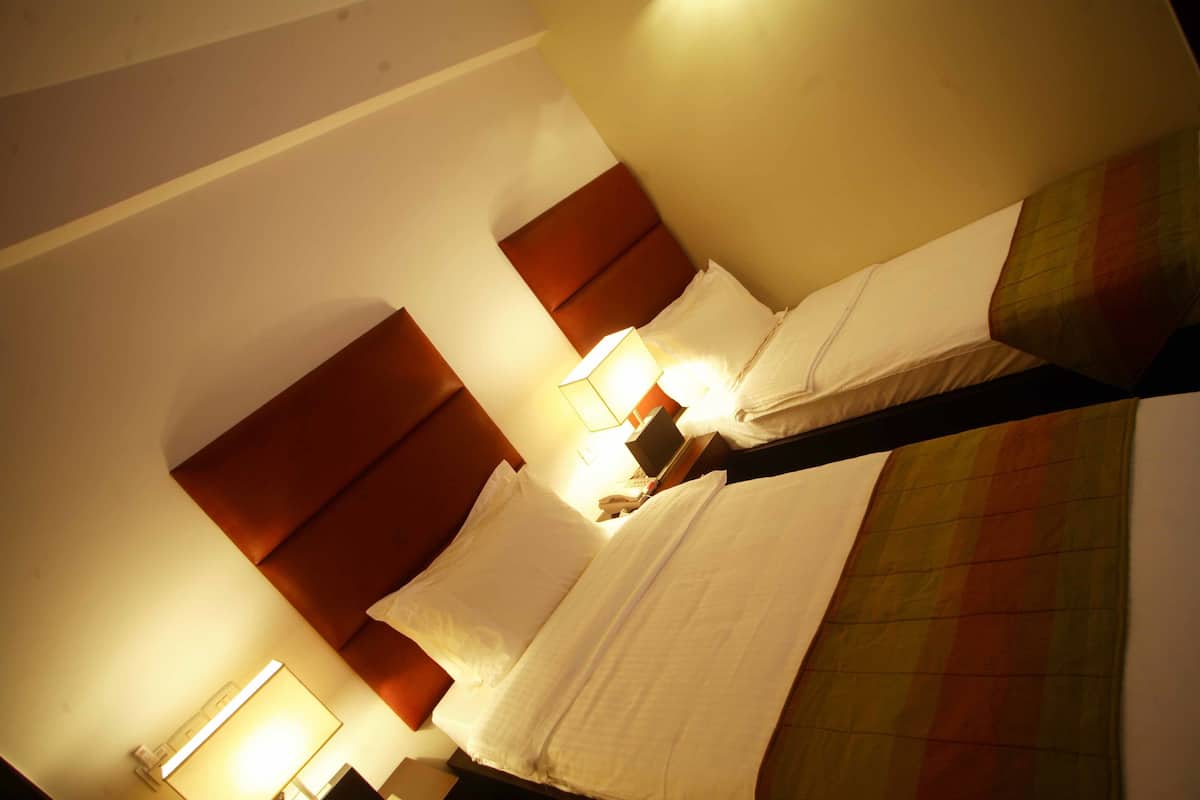 Chambre Deluxe avec lits jumeaux | Literie de qualité supérieure, minibar, coffres-forts dans les chambres