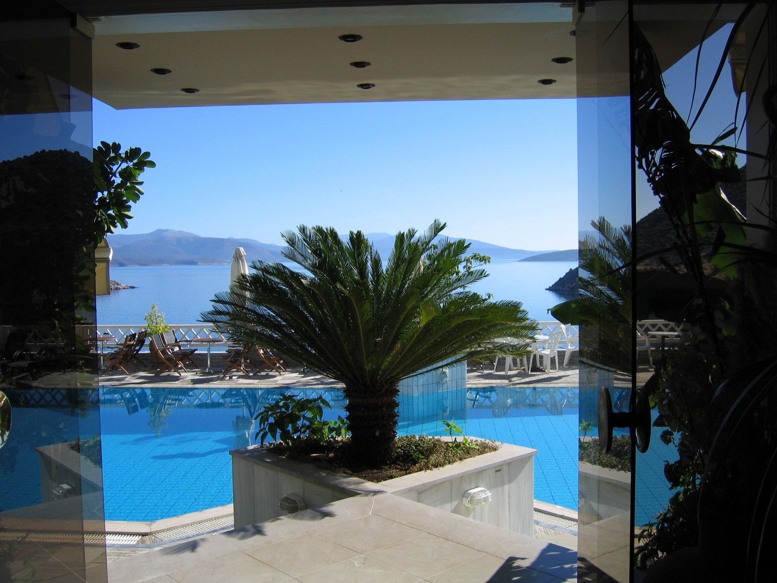 seasonal outdoor pool, open 7 am to 8 pm, pool umbrellas, pool loungers