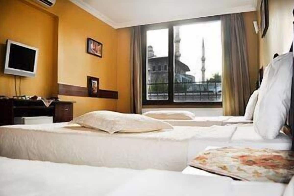 Triple Room | Minibar, in-room safe, desk, iron/ironing board