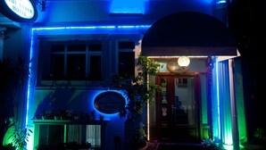 The exterior of the Blue Tianana Hotel with illuminated signage and a welcoming entrance. - Blue Tuana Hotel (Istanbul)