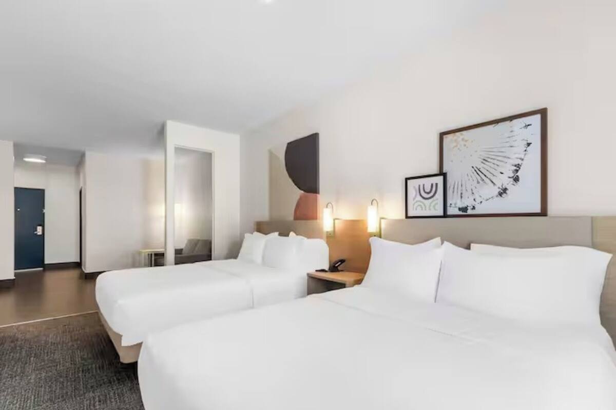 Down comforters, pillowtop beds, desk, blackout drapes