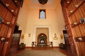 A grand entrance with ornate wooden doors and a central archway. - Avani Pemba Beach Hotel (Pemba)