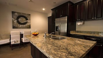 Junior Condo, 3 Bedrooms, Bathtub, Tower | Private kitchen | Full-sized fridge, microwave, oven, stovetop